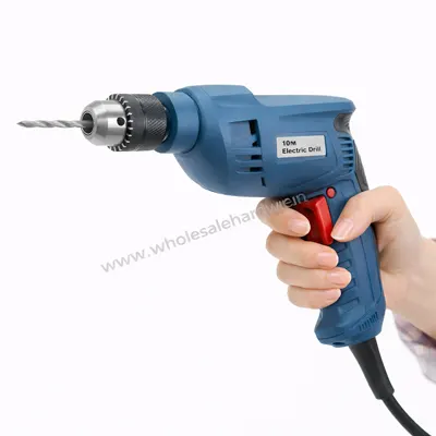 Blue electric drill machine held in hand with metal drill bit on clean white background