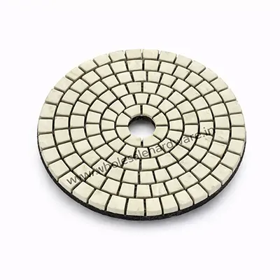Diamond polishing pad disc with segmented resin surface for stone and concrete polishing on white background.
