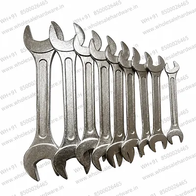 Set of silver double open end spanners arranged by size on a white background for automotive, mechanical and industrial use.